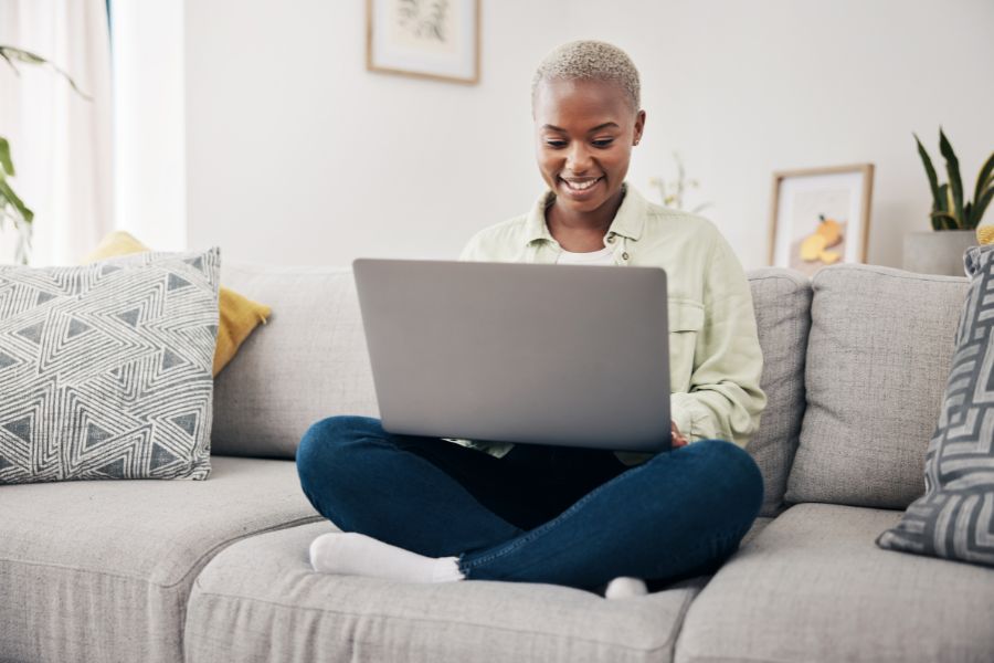Student smiling at computer